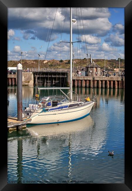 A yacht moored in Padstow Harbour, Cornwall. Framed Print by Gordon Maclaren
