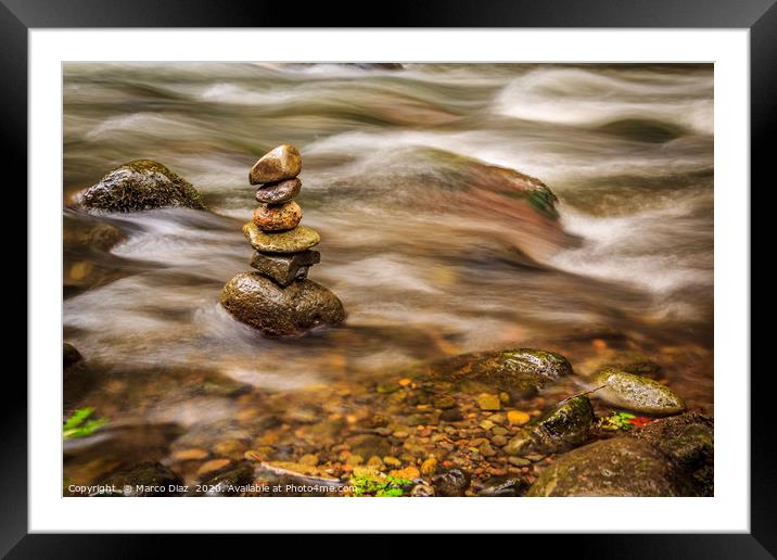 Stones in a zen position in a river in Costa Rica Framed Mounted Print by Marco Diaz