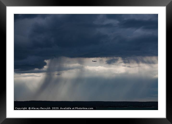 Air jet and the storm cloud. Moscow, Russia. Framed Mounted Print by Alexey Rezvykh