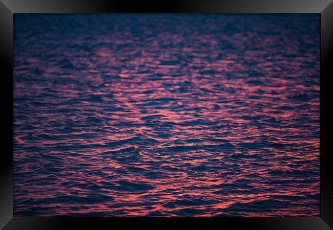 Water ripples in sunset. Framed Print by Alexey Rezvykh