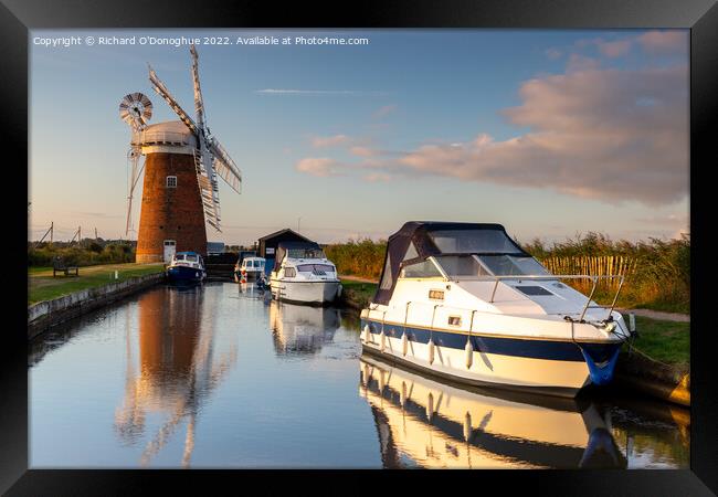 Boats moored at Horsey Mill on the Norfolk Broads at sunrise Framed Print by Richard O'Donoghue