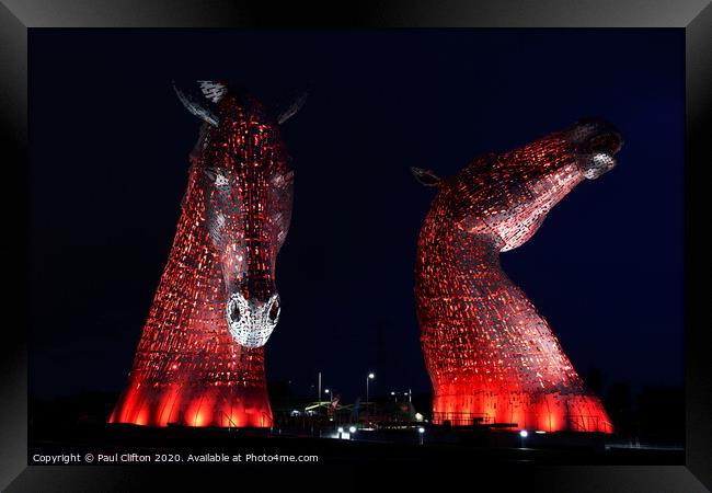 The Kelpies in red. Framed Print by Paul Clifton