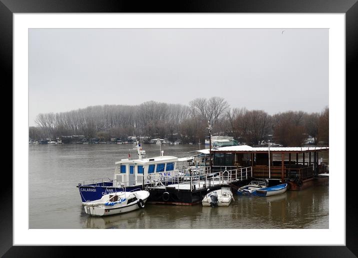 Boats anchored in winter on the Borcea arm  Framed Mounted Print by liviu iordache