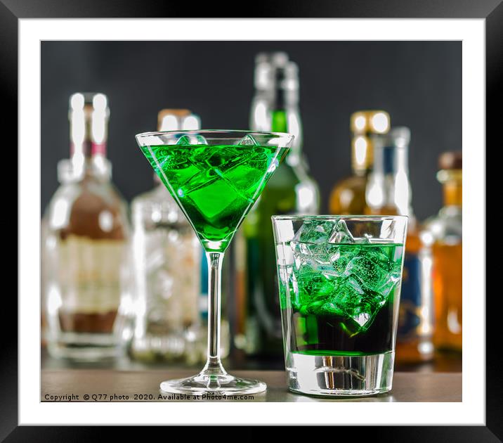 Colorful drink on the background of bottles in ori Framed Mounted Print by Q77 photo