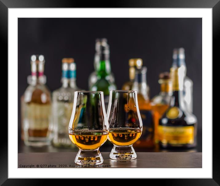 Colorful drink on the background of bottles in ori Framed Mounted Print by Q77 photo