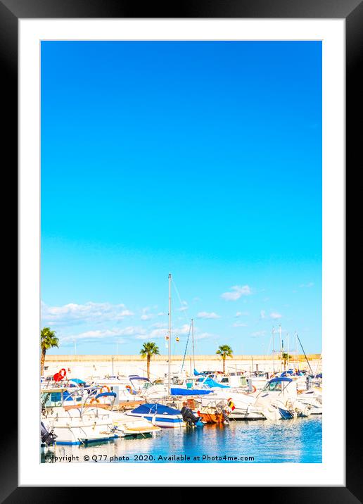 Beautiful luxury yachts and motor boats anchored i Framed Mounted Print by Q77 photo