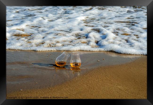 two glasses of whiskey single malt on the sand washed by the waves, a glass of tasting, relax on the beach Framed Print by Q77 photo