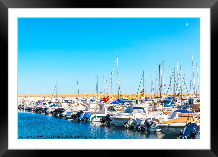 Beautiful luxury yachts and motor boats anchored in the harbor, hot summer day and blue water in the marina, blue sky Framed Mounted Print by Q77 photo