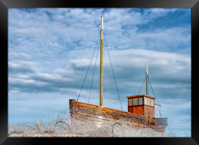 A Fishing Boat On A Sea Of Fishing Nets Framed Print by Rick Lindley