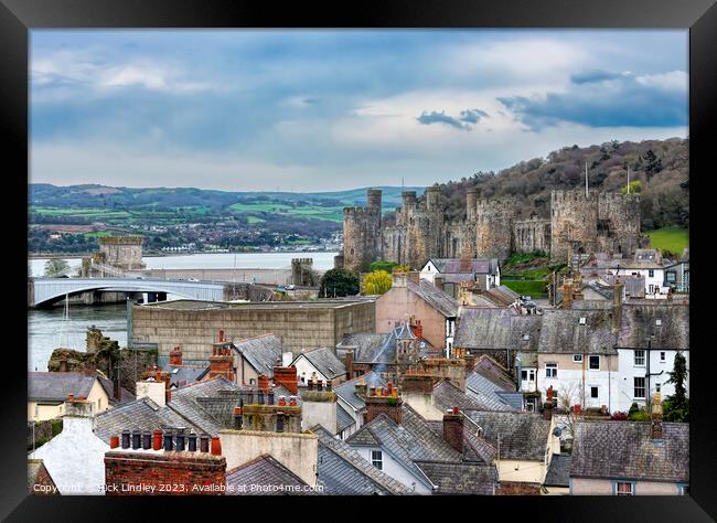 Conwy Castle Over The Rooftops Framed Print by Rick Lindley