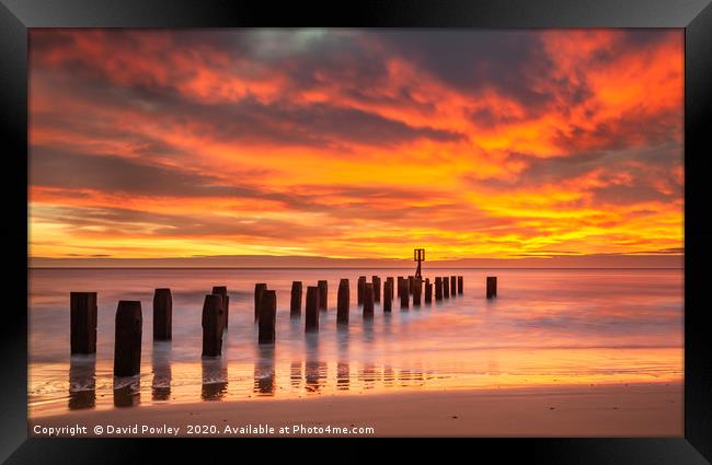 Sunrise over Lowestoft beach Suffolk Framed Print by David Powley