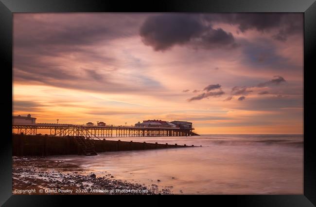 Cromer Pier at dusk Framed Print by David Powley