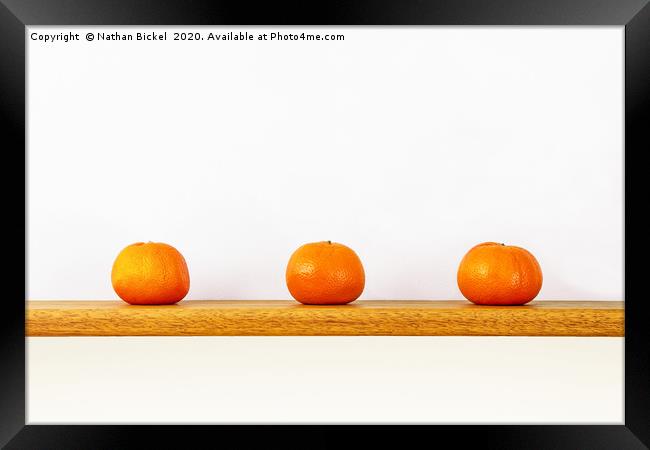 Three Oranges on a Shelf Framed Print by Nathan Bickel