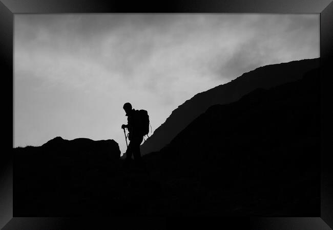 Silhouette of mountain guide  Framed Print by Christopher Stores