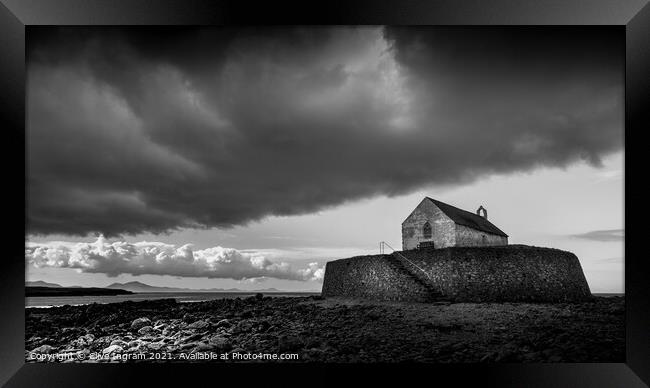 Moody Storm over St Cwyfans Framed Print by Clive Ingram