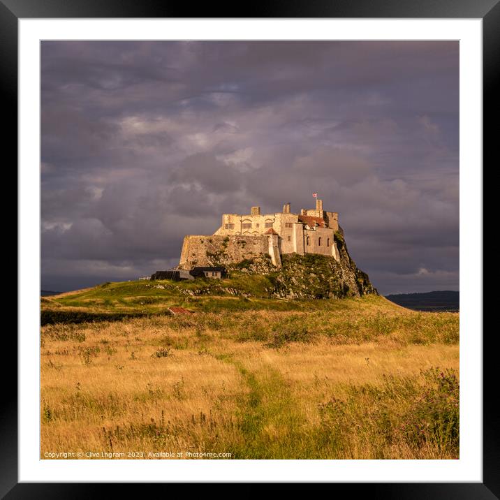 Storm clouds over Lindisfarne Castle Framed Mounted Print by Clive Ingram