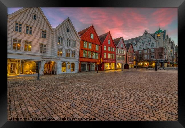 Historic charm at Bergen dawn Framed Print by Clive Ingram