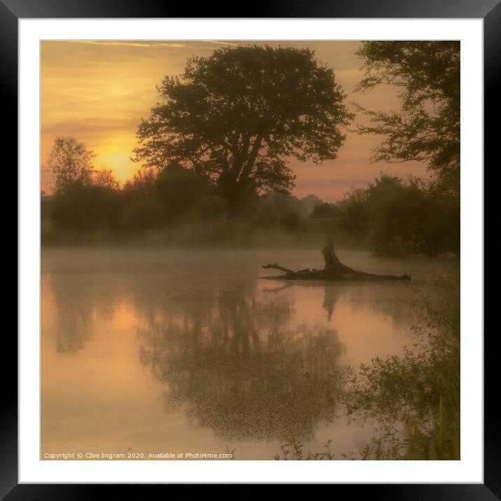 Mist over a pond at sunrise Framed Mounted Print by Clive Ingram