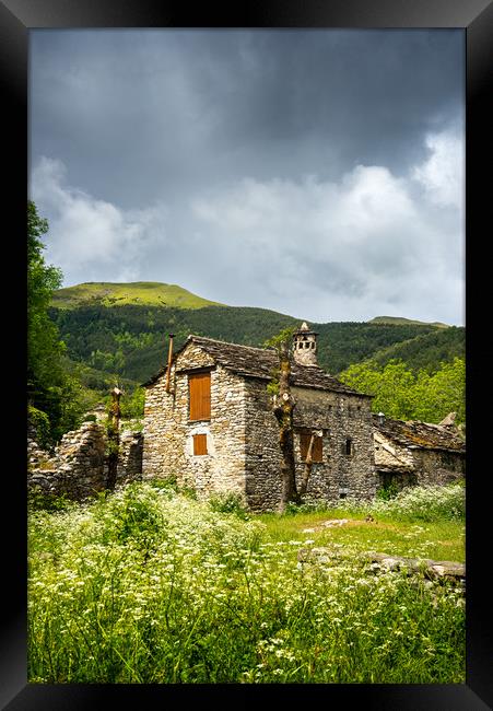 A rustic Spanish stone-walled cottage Framed Print by Stephen Rennie