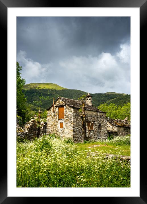 A rustic Spanish stone-walled cottage Framed Mounted Print by Stephen Rennie