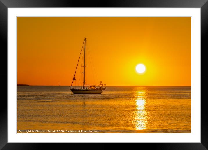 Yacht in orange sunset Framed Mounted Print by Stephen Rennie