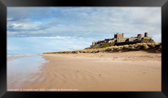 Bamburgh beach and castle, Northumberland Framed Print by Amanda Hart