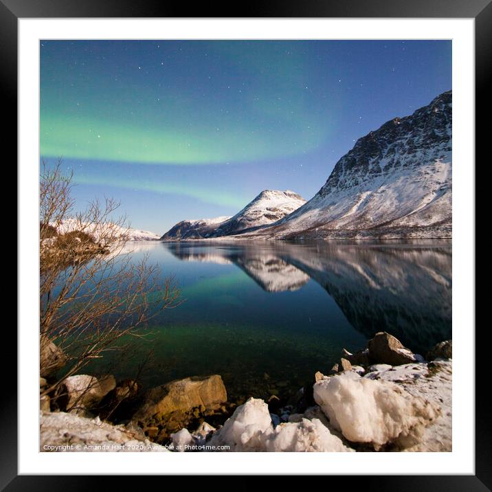 Northern lights over a fjord in Norway Framed Mounted Print by Amanda Hart