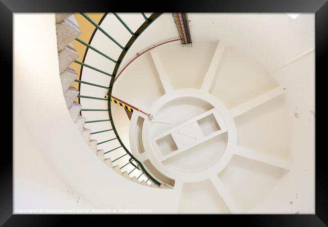 Spiral staircase inside a lighthouse Framed Print by Amanda Hart