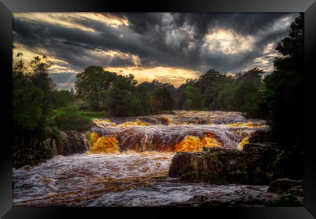 Low force waterfall during a storm Framed Print by simon cowan