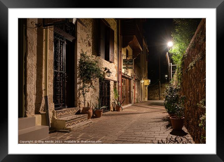 dark alley lit by a streetlight in the old town of Chania Framed Mounted Print by Stig Alenäs
