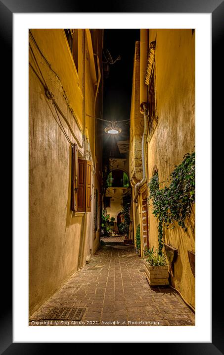 a dark alley in the old town of Chania, illuminated with a lamp  Framed Mounted Print by Stig Alenäs