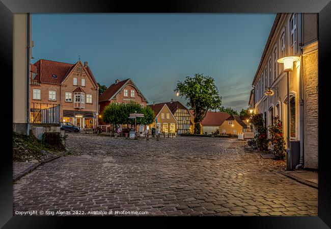 the illuminated square in the small Danish town of Mariager duri Framed Print by Stig Alenäs