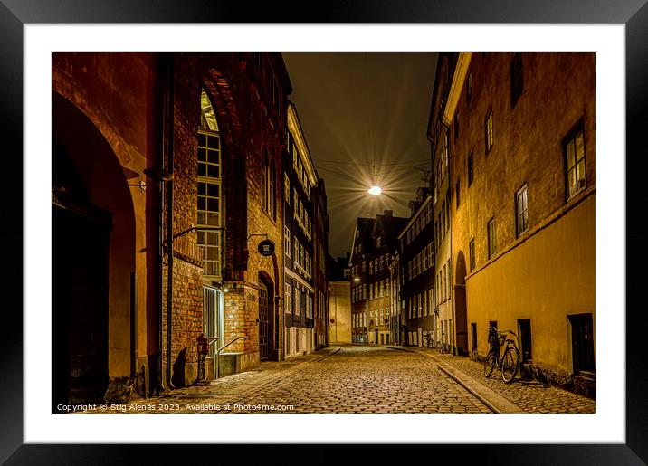 street lamp hanging over an alley at night in Copenhagen Framed Mounted Print by Stig Alenäs