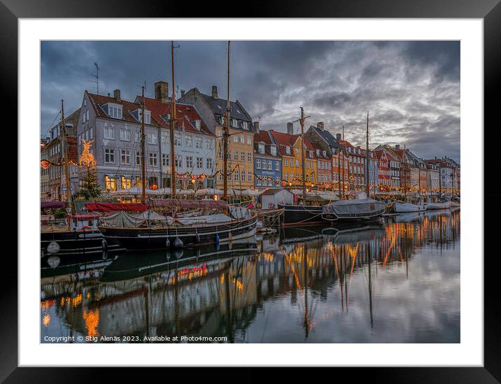 Christmas lights reflect in Copenhagen Nyhavn canal at dusk Framed Mounted Print by Stig Alenäs