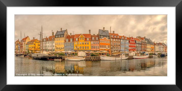panorama of Nyhavn with colorful houses and boats moored at the  Framed Mounted Print by Stig Alenäs