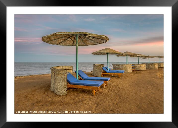 loungers and shelters in a row at the sunset on a  Framed Mounted Print by Stig Alenäs