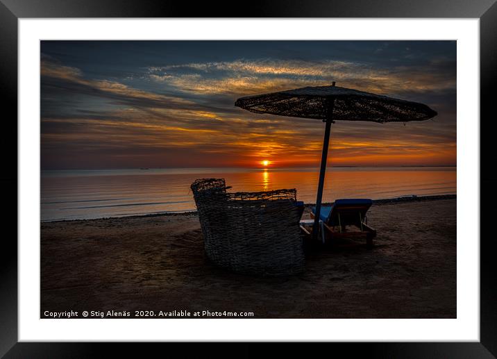 a shelter and loungers at the beach in the sunset Framed Mounted Print by Stig Alenäs