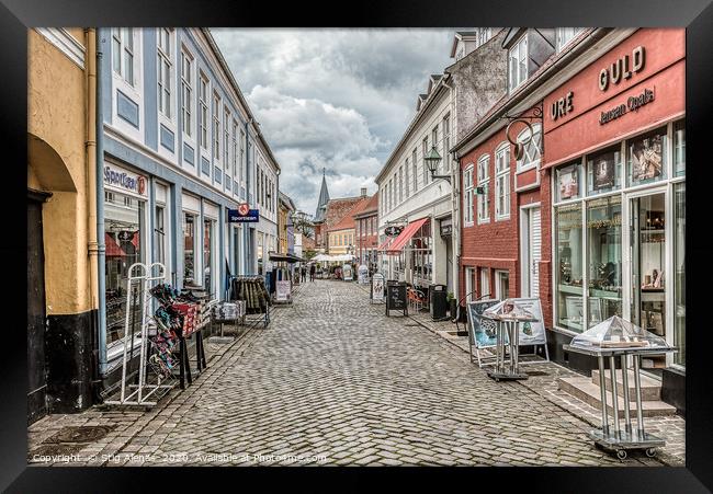 Shopping street  with many different stores in Ebe Framed Print by Stig Alenäs
