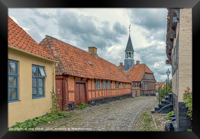The old town of Ebeltoft with a  cobblestone-stree Framed Print by Stig Alenäs