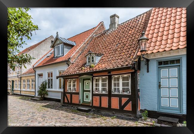 A romantic fairytale halftimbered house on a cobbl Framed Print by Stig Alenäs