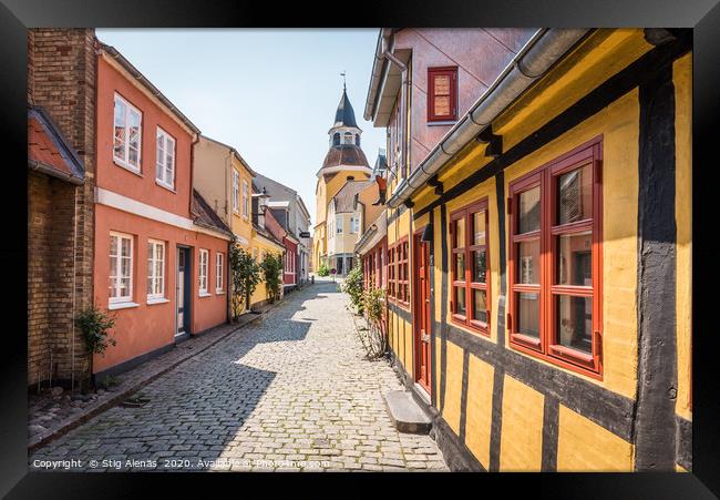 An alleyway with cobblestones and half timbered ho Framed Print by Stig Alenäs