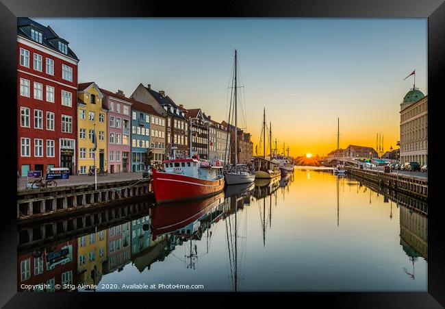 The tranquil water of Nyhavn an early morning Framed Print by Stig Alenäs