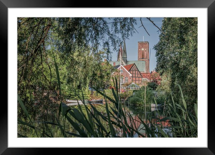 a view of the cathedral of Ribe among the reeds Framed Mounted Print by Stig Alenäs