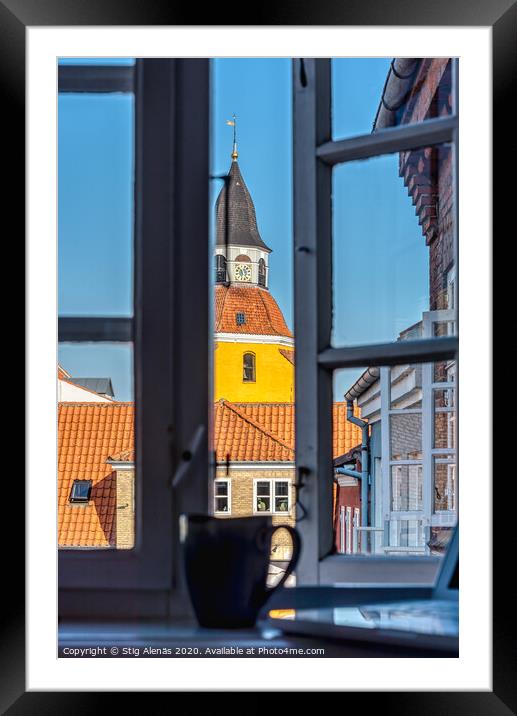a coffee mug and a laptop in the window frame and a yellow tower Framed Mounted Print by Stig Alenäs