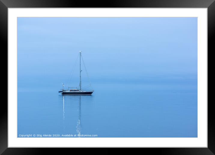 Lonely Black yacht in the ocean before sunrise Framed Mounted Print by Stig Alenäs