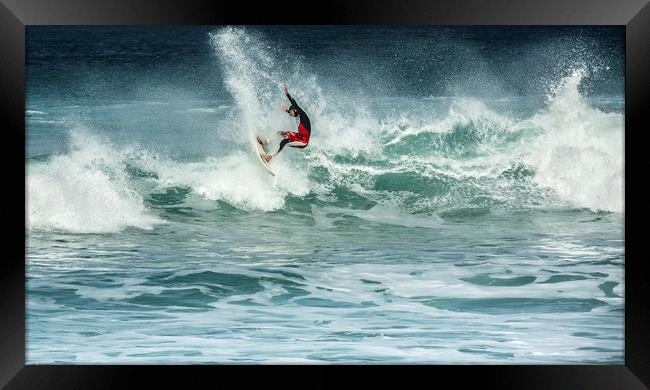 Action in the surf Framed Print by Mick Blakey