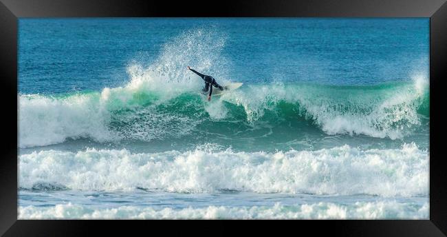 Surfer riding crest of wave, Fistral, Newquay, Cor Framed Print by Mick Blakey