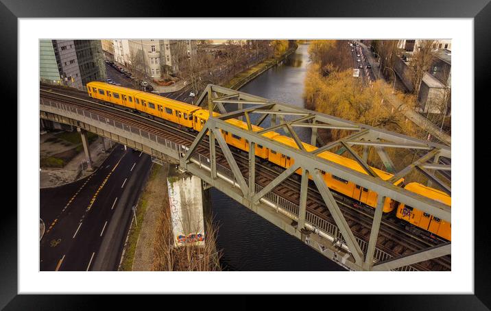 The yellow cars of the Berlin metro Framed Mounted Print by Erik Lattwein