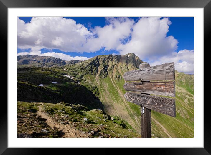 Direction signs at Timmelsjoch High Alpine Road in the Austrian Alps also called Passo Rombo Framed Mounted Print by Erik Lattwein