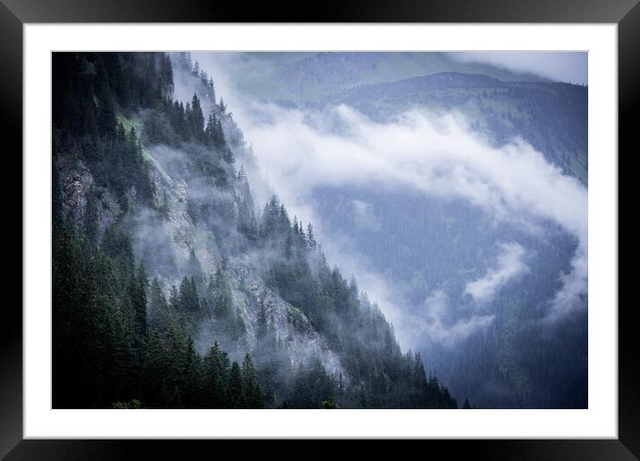 A rainy day in the Austrian Alps with deep clouds and fog Framed Mounted Print by Erik Lattwein